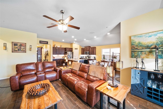 kitchen featuring light stone countertops, sink, dishwasher, dark hardwood / wood-style flooring, and a fireplace