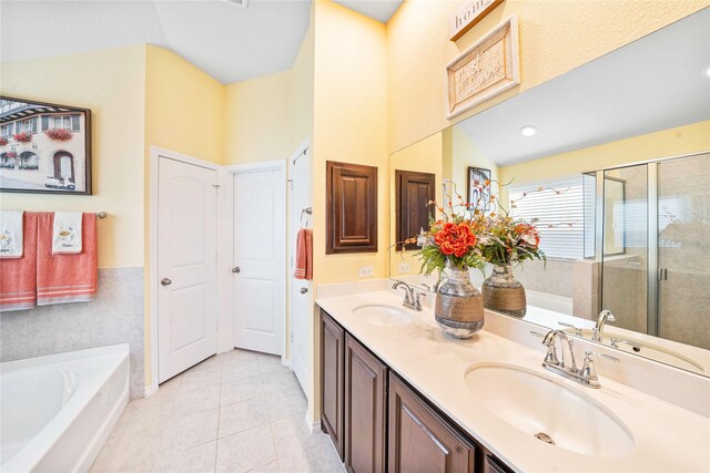 bathroom featuring tile patterned floors, ceiling fan, vanity, and a shower with shower door