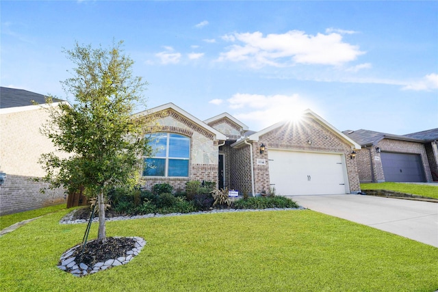 view of front of house with a garage and a front lawn