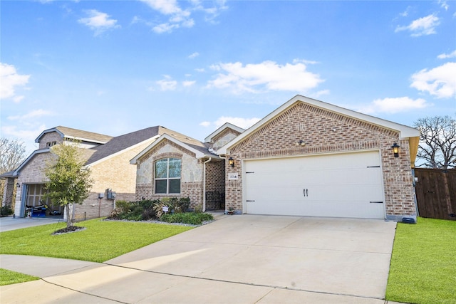 view of front of home featuring a garage and a front lawn