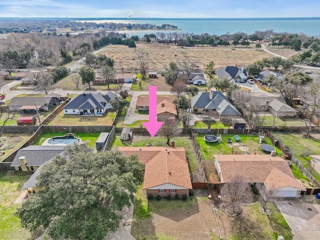 birds eye view of property featuring a water view