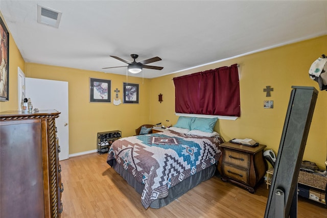 bedroom featuring ceiling fan and light hardwood / wood-style floors