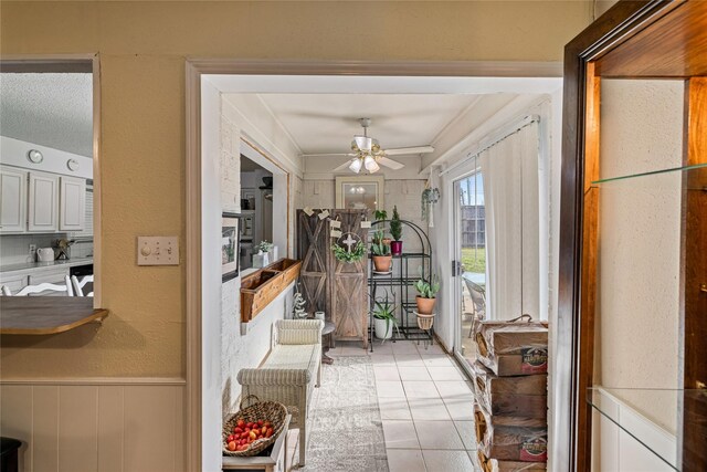 interior space with ceiling fan