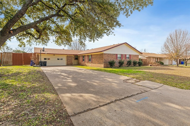 ranch-style home featuring a front lawn and a garage