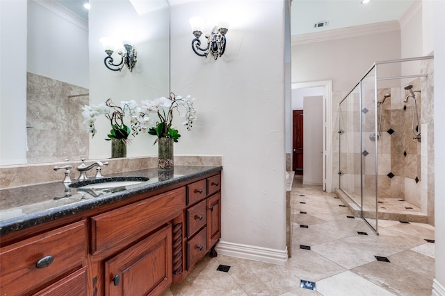 bathroom featuring ornamental molding, vanity, and a shower with shower door