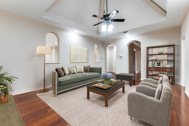 living room with ceiling fan, a raised ceiling, and light hardwood / wood-style flooring