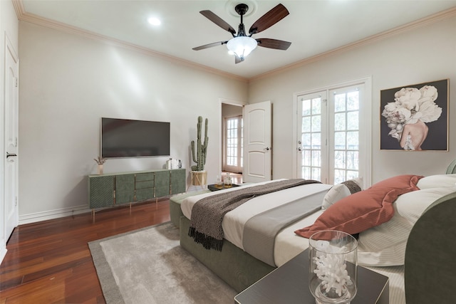 bedroom with ornamental molding, dark hardwood / wood-style floors, and ceiling fan