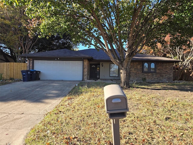 ranch-style house with a front lawn and a garage