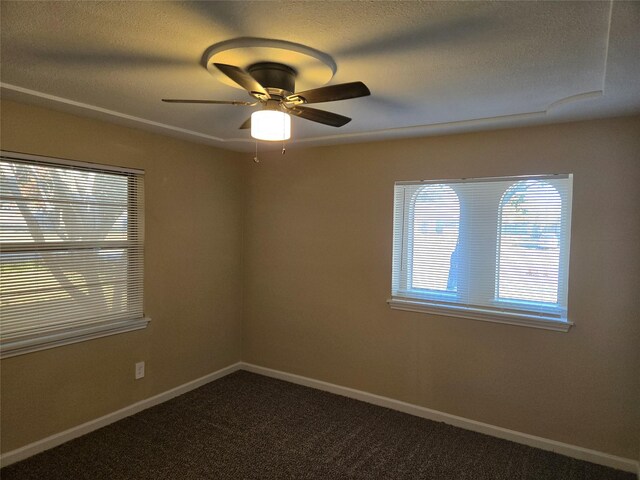 unfurnished room with ceiling fan and carpet floors