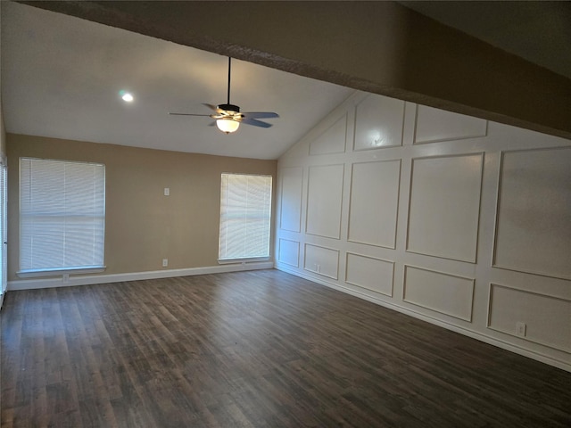 interior space with ceiling fan, dark wood-type flooring, and vaulted ceiling