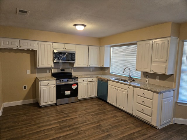 kitchen with dark hardwood / wood-style flooring, white cabinetry, sink, and appliances with stainless steel finishes