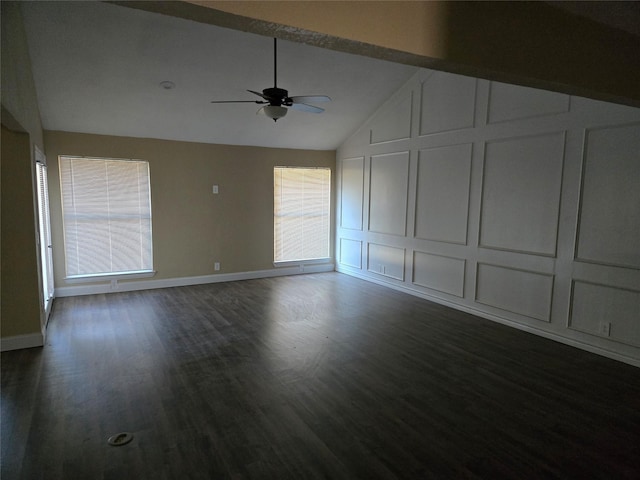 unfurnished living room featuring ceiling fan, lofted ceiling, and dark wood-type flooring