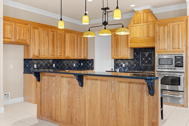 kitchen with light tile patterned floors, crown molding, a breakfast bar, appliances with stainless steel finishes, and decorative light fixtures