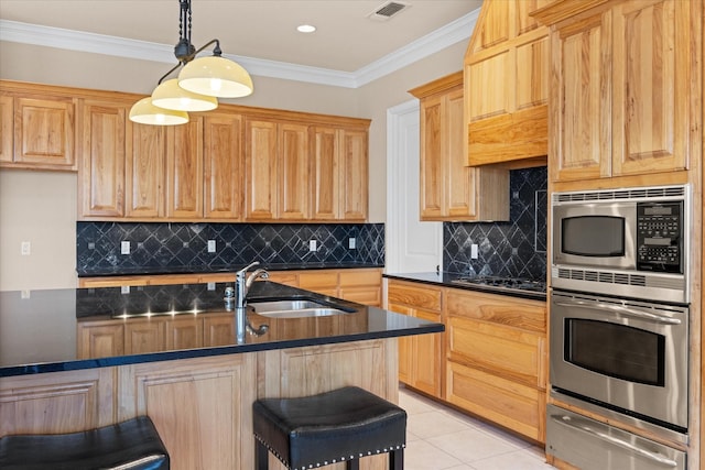 kitchen featuring sink, appliances with stainless steel finishes, a breakfast bar area, light tile patterned flooring, and ornamental molding