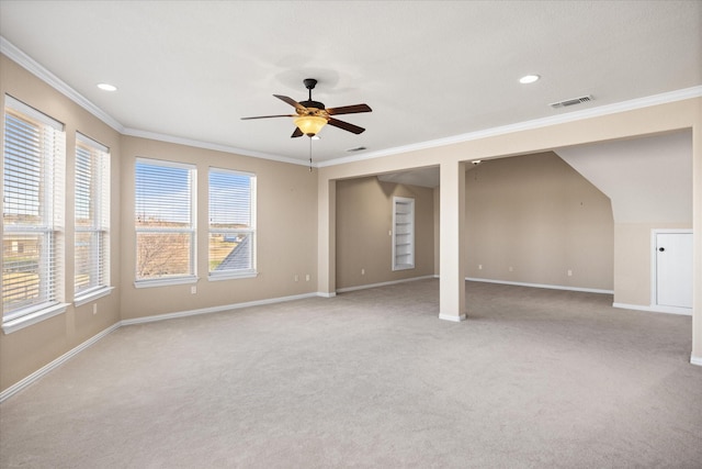 carpeted spare room with ornamental molding and ceiling fan