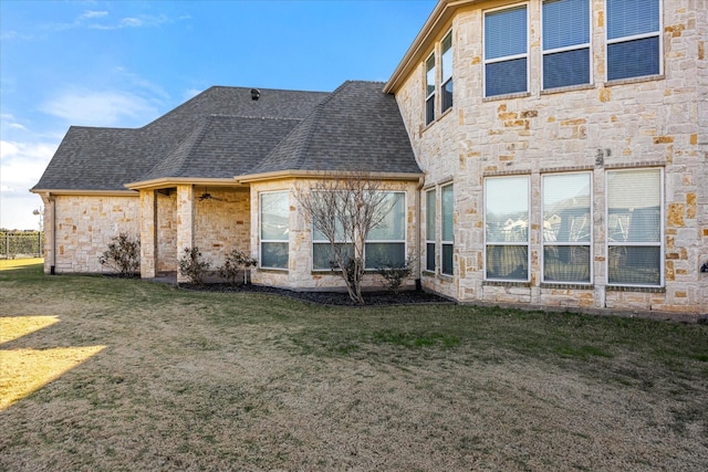 rear view of house with a yard