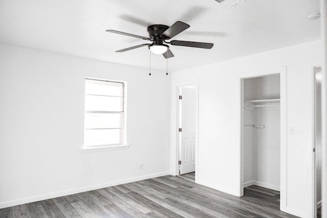 unfurnished bedroom featuring hardwood / wood-style flooring and ceiling fan