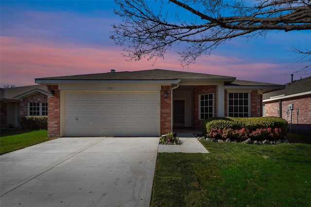 ranch-style home with a lawn and a garage