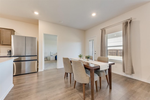 dining area featuring light wood-type flooring