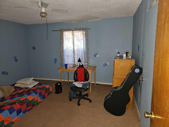 carpeted bedroom featuring ceiling fan and a textured ceiling