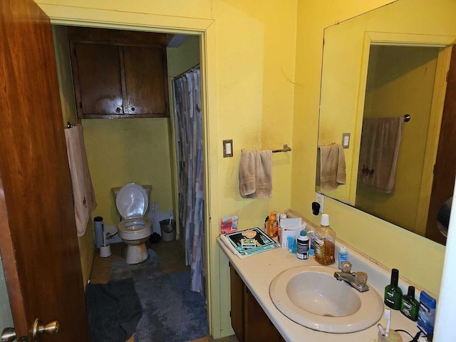 bathroom with vanity and toilet