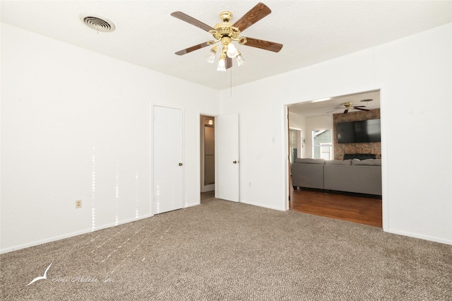 unfurnished bedroom with carpet and ceiling fan