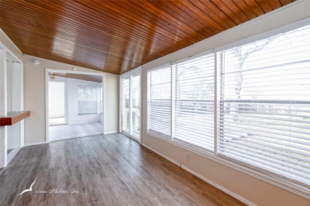 unfurnished sunroom with wooden ceiling and vaulted ceiling