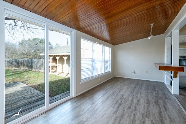 interior space featuring wood ceiling and a wealth of natural light