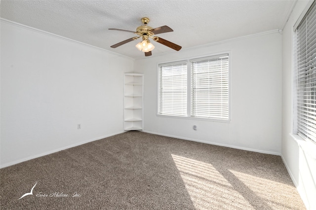 empty room featuring carpet flooring, ceiling fan, ornamental molding, and a textured ceiling