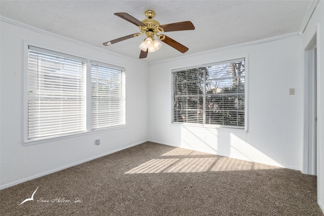 carpeted spare room featuring a textured ceiling, ceiling fan, and crown molding