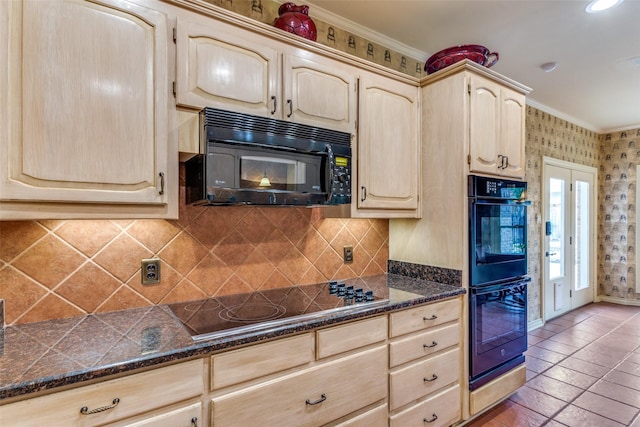 kitchen featuring light brown cabinetry, black appliances, dark stone countertops, ornamental molding, and backsplash