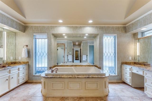 bathroom featuring ornamental molding, lofted ceiling, and vanity