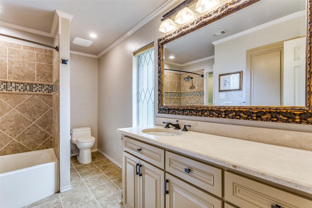 full bathroom featuring vanity, ornamental molding, tile patterned floors, toilet, and tiled shower / bath