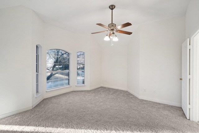 empty room with ceiling fan, light colored carpet, and lofted ceiling