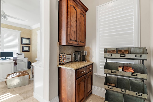 kitchen with crown molding and tasteful backsplash