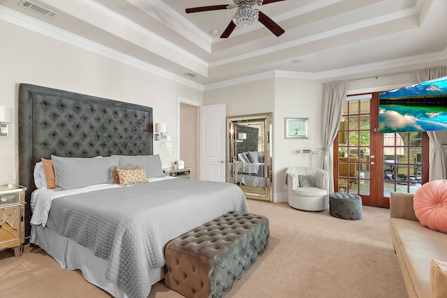 carpeted bedroom with access to exterior, ceiling fan, a raised ceiling, and crown molding