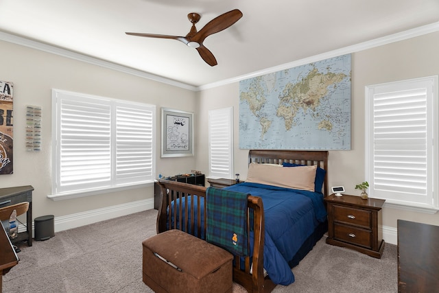 bedroom with ceiling fan, crown molding, and light carpet