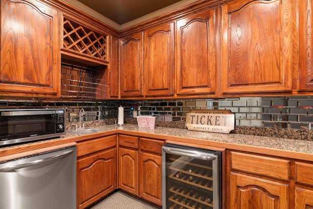 kitchen featuring stainless steel appliances, wine cooler, tasteful backsplash, and sink