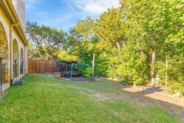 view of yard with a trampoline