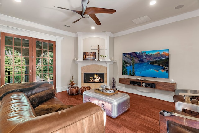 living room featuring french doors, hardwood / wood-style flooring, ceiling fan, and ornamental molding