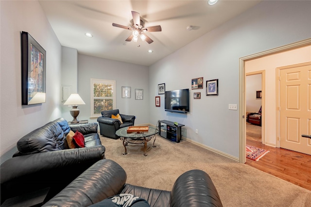 carpeted living room featuring ceiling fan