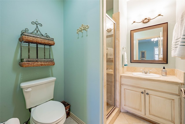 bathroom featuring toilet, tile patterned flooring, an enclosed shower, and vanity