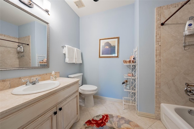 full bathroom with toilet, tile patterned flooring, tiled shower / bath combo, and vanity