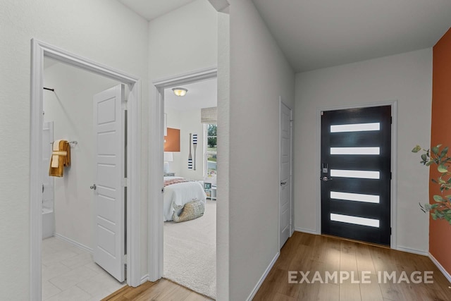 foyer entrance featuring light wood-type flooring