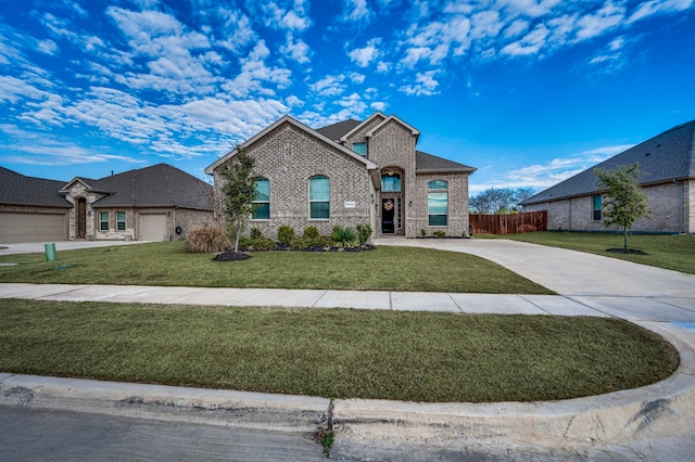 view of front of house with a front lawn and a garage