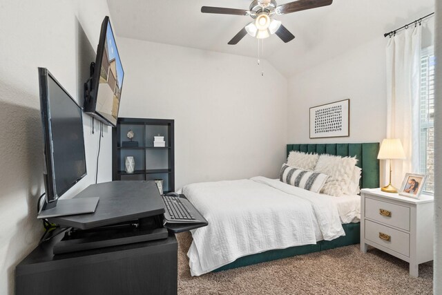 bedroom with light carpet, vaulted ceiling, and ceiling fan