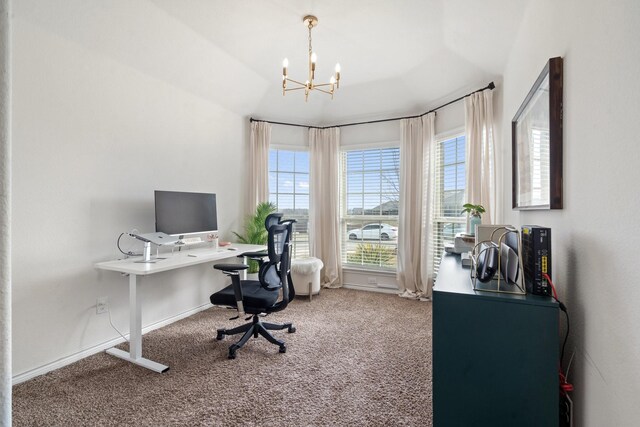 office with carpet floors and a notable chandelier