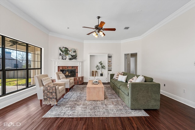 living room featuring ceiling fan, ornamental molding, and dark hardwood / wood-style floors