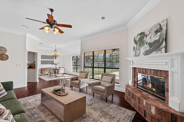 living room with dark wood-type flooring, ornamental molding, and a brick fireplace