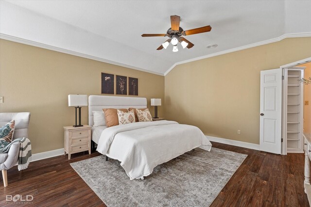 bedroom with crown molding, dark wood-type flooring, vaulted ceiling, and ceiling fan